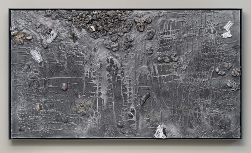 Textured mixed-media wall piece titled Morphium (2024) by Lynn Basa, measuring 40 x 72 x 2 inches. The rectangular work features a dark, monochromatic palette with layered, glossy gray and black surface textures, intersecting grid-like lines, and clusters of embedded organic and rock-like forms.